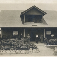 J.T. Wilson and family posing in front of their two-story home, San Fernando, CA.