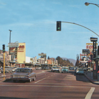 Reseda, CA. Sherman Way with shops and cars.